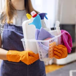 Woman holding cleaning supplies for spring clean