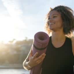 Happy woman with a yoga map